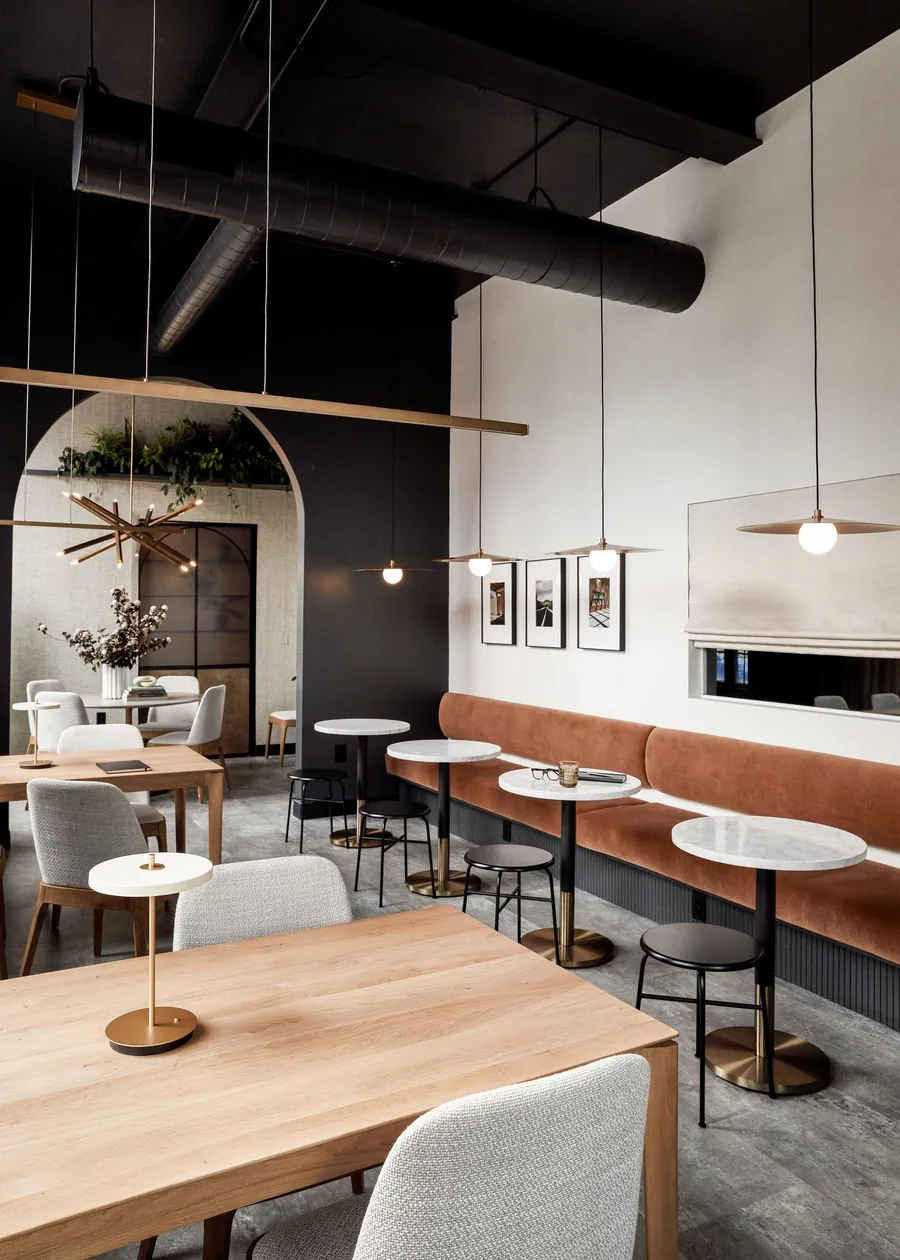 Suite 101: cafe tables beside a long leather banquette