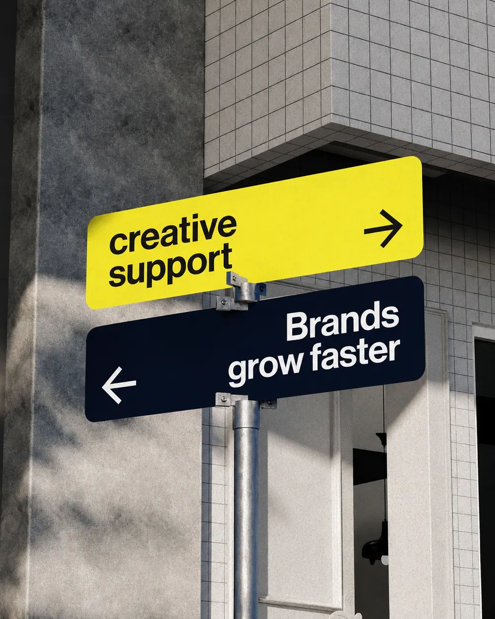 Street signs reading creative support and Brands grow faster