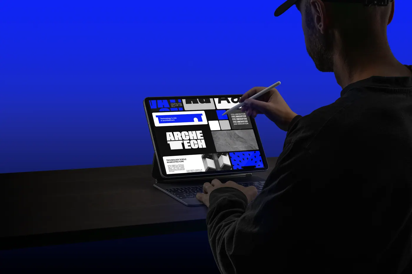 A designer sketching Arche-tech layouts on a tablet