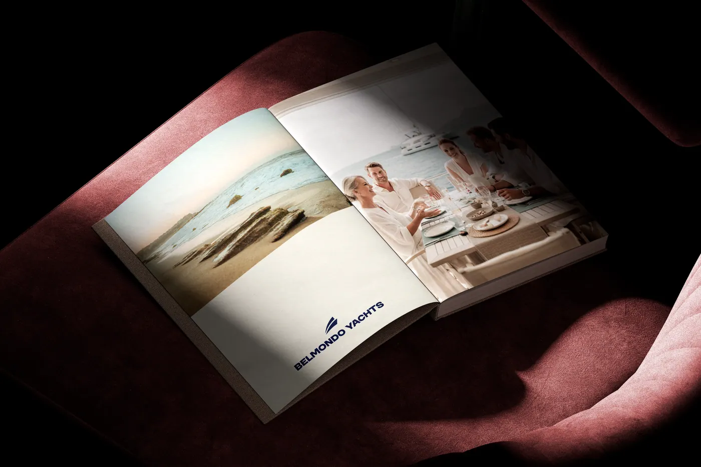 An open Belmondo Yachts magazine on a velvet chair