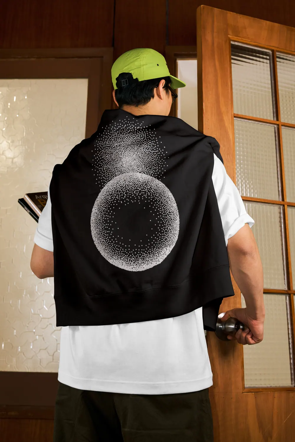 A jacket with the Orbit sphere printed across its back